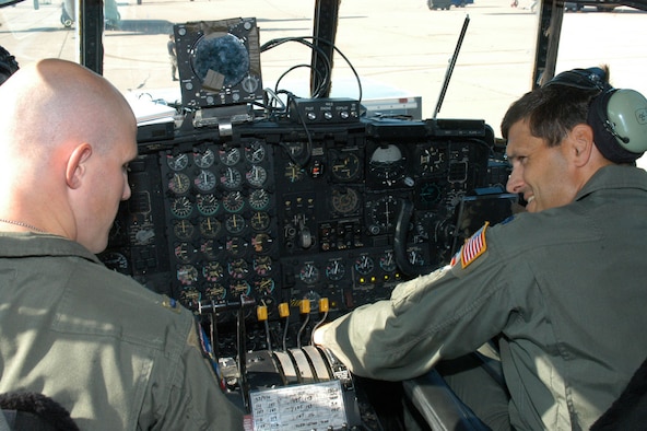 Left: First Lt. Matt Sartori, 39th Airlift Squadron pilot, goes over a pre-flight checklist with Lt. Col. Bret Crenwelge, 39th AS pilot.                                