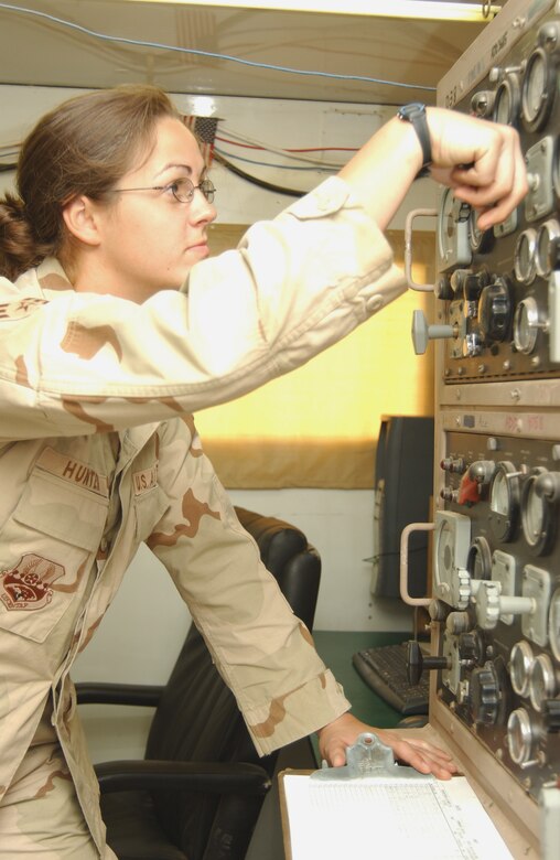 Senior Airman Lorraine Hunter checks the electrical systems used by the mobile aircraft arresting system July 26 at Balad Air Base, Iraq. She is assigned to the 332nd Air Expeditionary Civil Engineer Squadron. (U.S. Air Force photo/Senior Airman Kerry Solan-Johnson) 