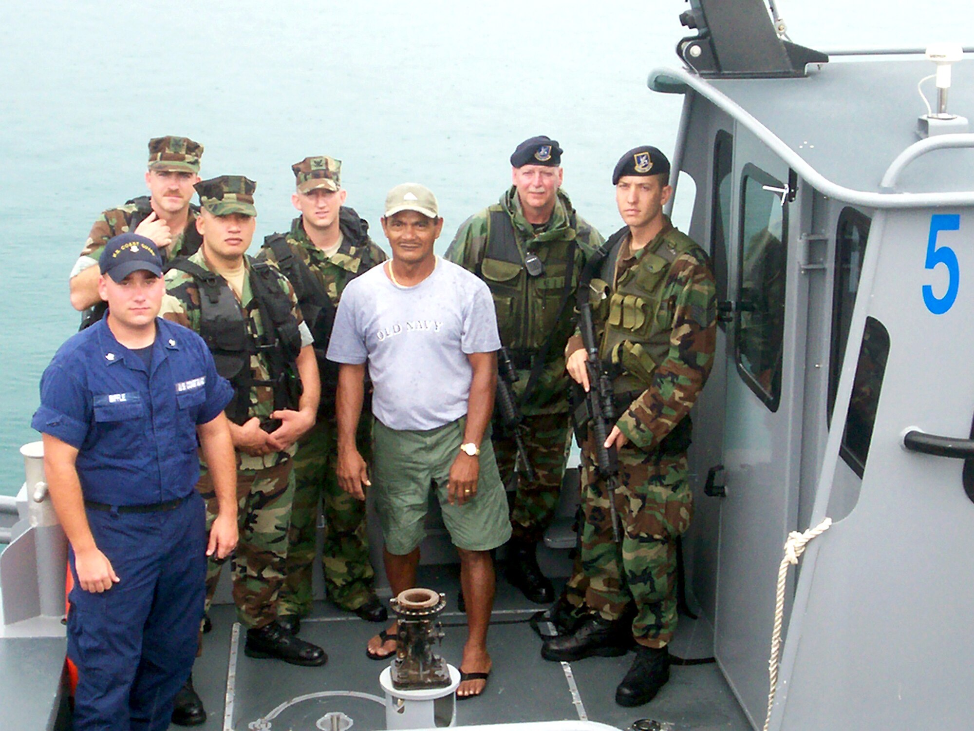 The first joint operation involving Air Force, Navy and Coast Guard security forces set out to patrol the shores of Guam July 26. Crewmembers on the first patrol included Petty Officer 1st Class Kevin Hammon, Petty Officer 2nd Class Brandon Johnson, Petty Officer 3rd Class Craig Tobey and Ray Gutierrez, all from the Naval Harbor Patrol; Coast Guard Petty Officer 3rd Class Richard Biffle; and Senior Master Sgt. Ray Johnson and Staff Sgt. Jason Bateman from the 36th Security Forces Squadron. (Courtesy photo)
