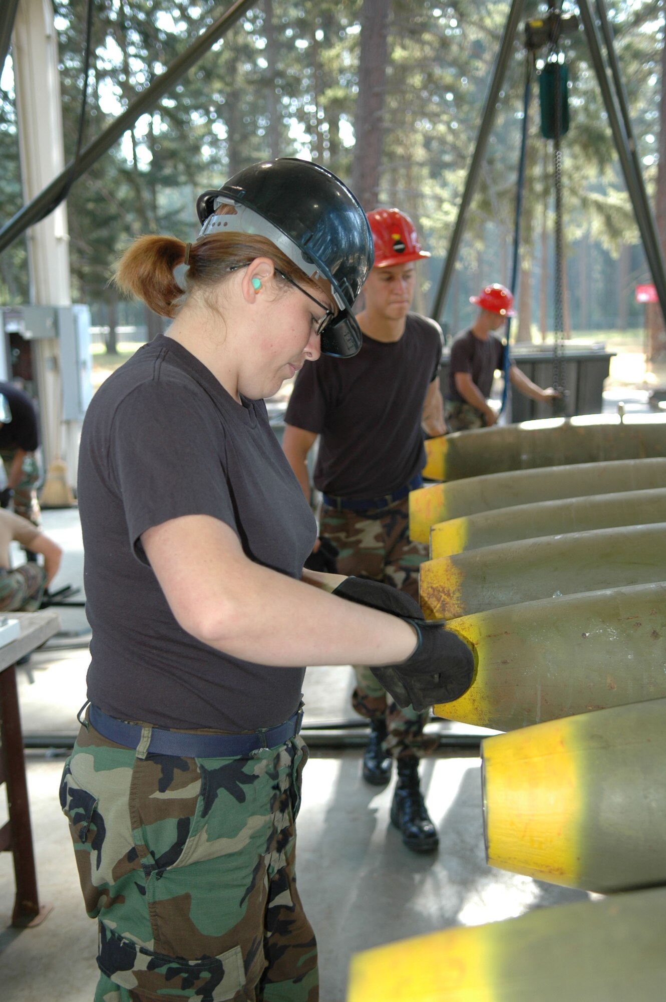 Senior Airman Christina Currington, munition specialist from the  917th Munitions Flight builds MK-82 bombs in support of Operation Patriot Knife, Aug. 7. The 47th Fighter Squadron is deployed to McChord AFB, Wash., where they are dropping live munitions on the Yakima Range for training of A-10 personnel assigned to the 917th Reserve Wing at Barksdale AFB, La. (Photo by Senior Master Sgt. Jessica D'Aurizio)
