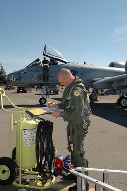 Capt. Clifford Russell, 47th Fighter Squadron pilot, completes aircraft forms documentation after landing from a flying mission over the Yakima Range in support of Operation Patriot Knife, Aug. 6. The 47th Fighter Squadron is deployed to McChord AFB, Wash., where they are dropping live munitions on the Yakima Range for training of A-10 personnel assigned to the 917th Reserve Wing at Barksdale AFB, La. (U.S. Air Force Photo/Senior Master Sgt. Jessica D'Aurizio)