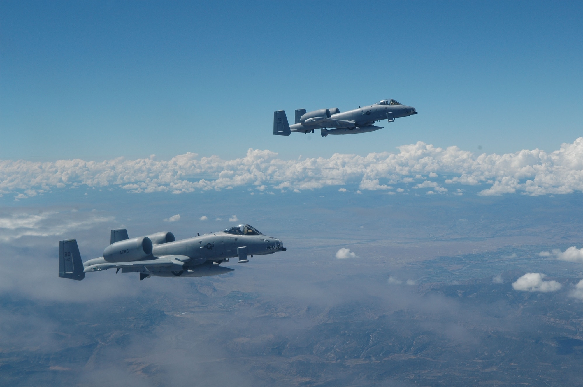 Two 47th Fighter Squadron A-10s fly over Colorado, on their way to McChord AFB, Wash., in support of Operation Patriot Knife Aug. 5, 2006. The aircraft  wait for a third A-10 off the wing of a 70th Air Refueling Wing KC-10 from Travis AFB, Calif. (U.S. Air Force Photo/ Senior Master Sgt. Jessica D'Aurizio)