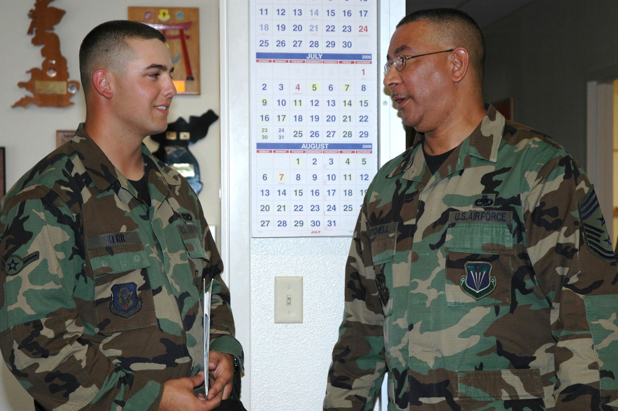 Air Force Reservist, Airman Joshua Kerr, 940 Civil Engineering Squadron pavements and equipment apprentice, meets Chief Master Sgt. Kenneth A. Mitchell, 4th Air Force command chief, during the newcomers briefing Aug. 5, 2006 at Beale Air Force Base, Calif.  Chief Mitchell visited the 940th Air Refueling Wing Aug. 5-6 to see Reservists and thank them for their service. (U.S. Air Force photo/Tech. Sgt. Brynna Bryant) 