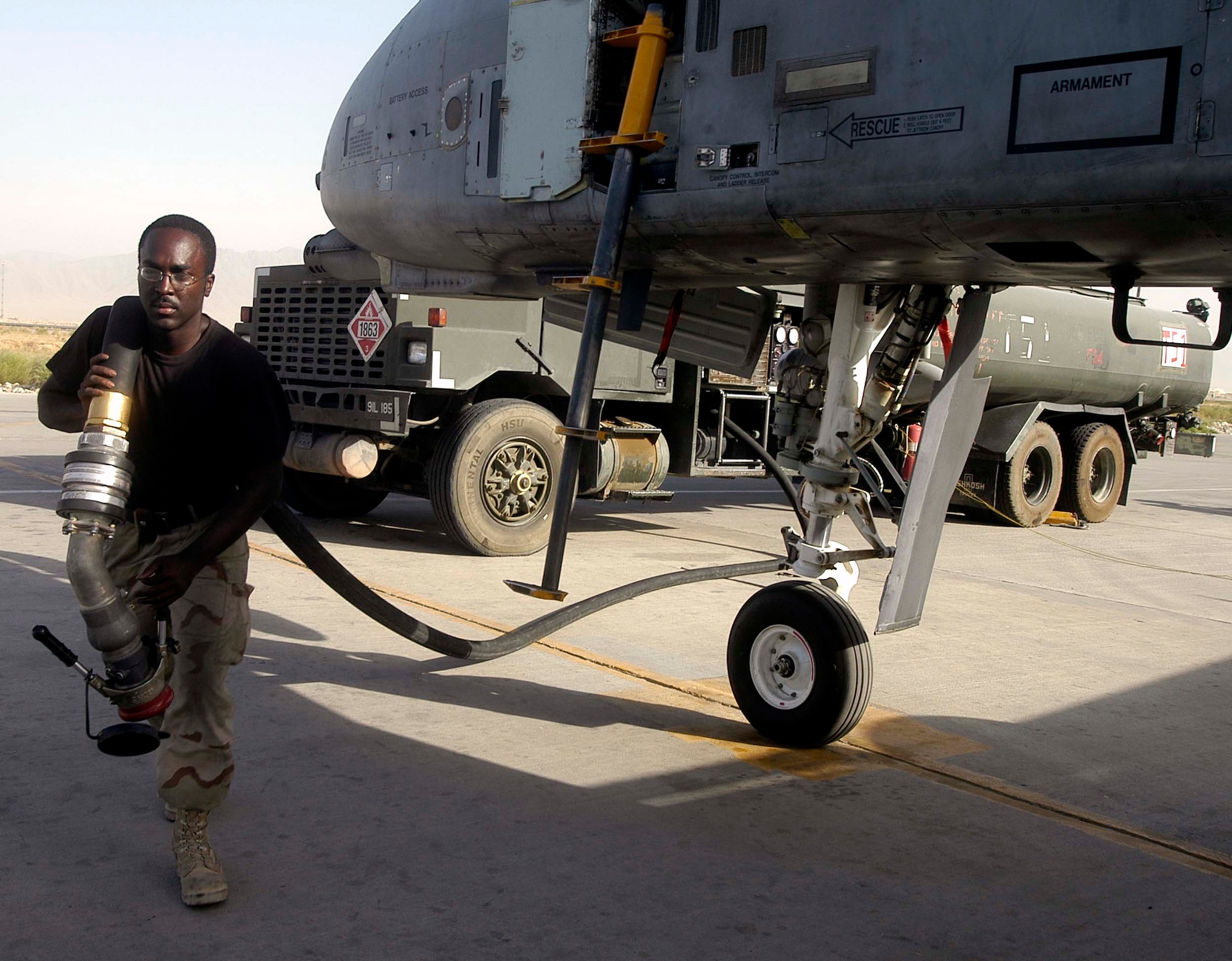 Airman 1st Class Christopher Leach hauls a fuel hose from a tanker truck to an A-10 Thunderbolt II at Bagram Air Base, Afghanistan, on Aug. 5. Airman Leach has pumped more than 1 million gallons of jet fuel during his four-month air expeditionary force rotation at Bagram. The 455th Expeditionary Logistics Readiness Squadron Petroleum, Lubricants and Oil Flight has delivered almost 6.6 million gallons of fuel to military and civilian aircraft at Bagram since May. Airman Leach is deployed from Dover Air Force Base, Del. (U.S. Air Force photo/Maj. David Kurle)
