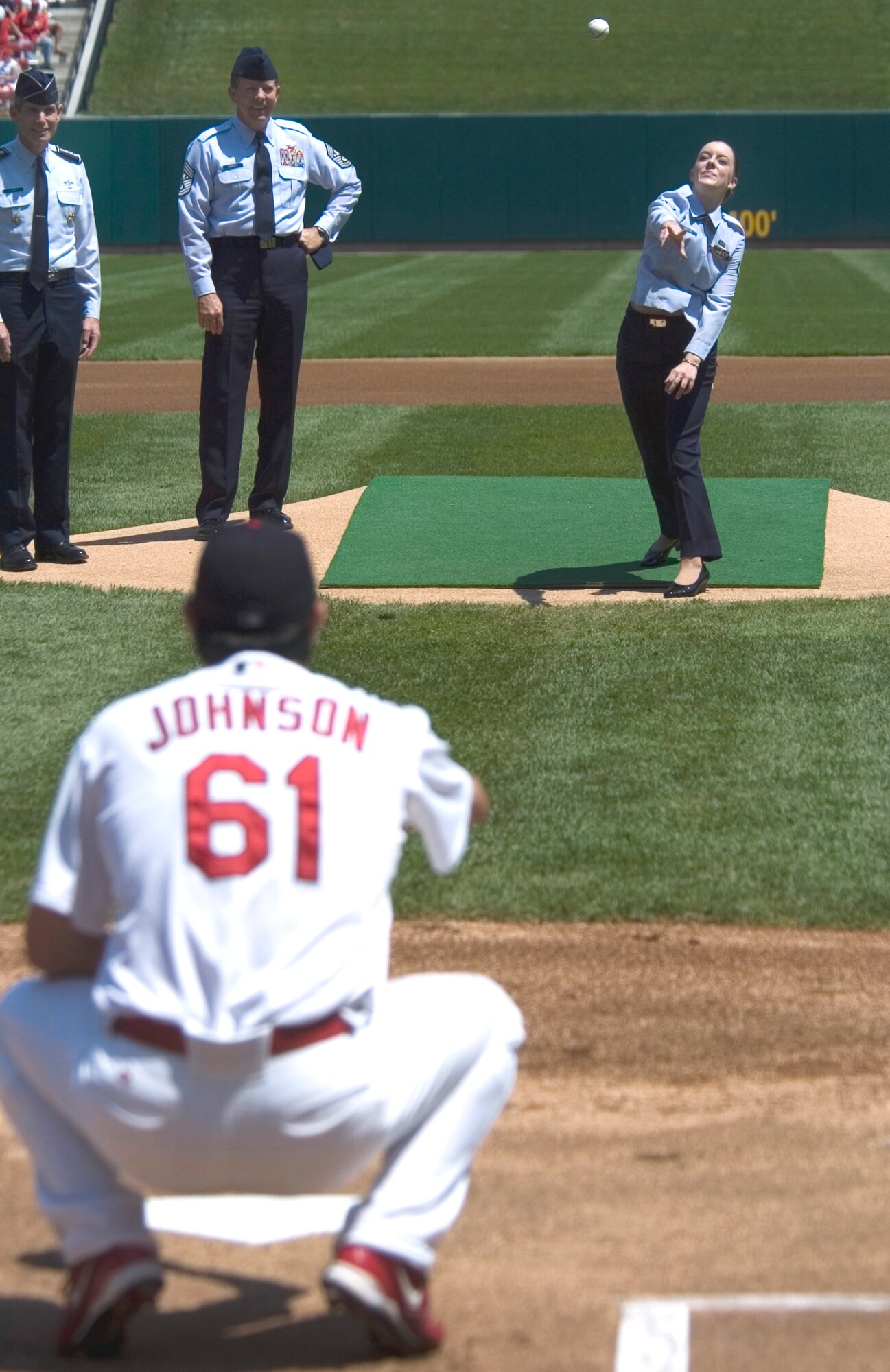 Airman 1st Class Rebecca Blascak throws out the first pitch of the St. Louis Cardinals game at Busch Stadium on Aug. 6. Airman Blascak was accompied by Gen. Norton A. Schwartz, commander of the U.S. Transportation Command, and Chief Master Sgt of the Air Force Rodney McKinley. The pitch was part of a ceremony kicking off Air Force Week in St Louis. Airman Blascak is a vehicle operator with the 375th Logistics Readiness Squadron at Scott Air Force Base, Ill. (U.S. Air Force photo/Master Sgt. Jack Braden)