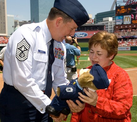 Chief Master Sgt. of the Air Force Rodney J. McKinley presents an Air Force bear to Maxine Clark of St. Louis at a Cardinals game at Busch Stadium on Aug. 6. The game kicked off Air Force Week in St. Louis. (U.S. Air Force photo/Master Sgt. Jack Braden)


