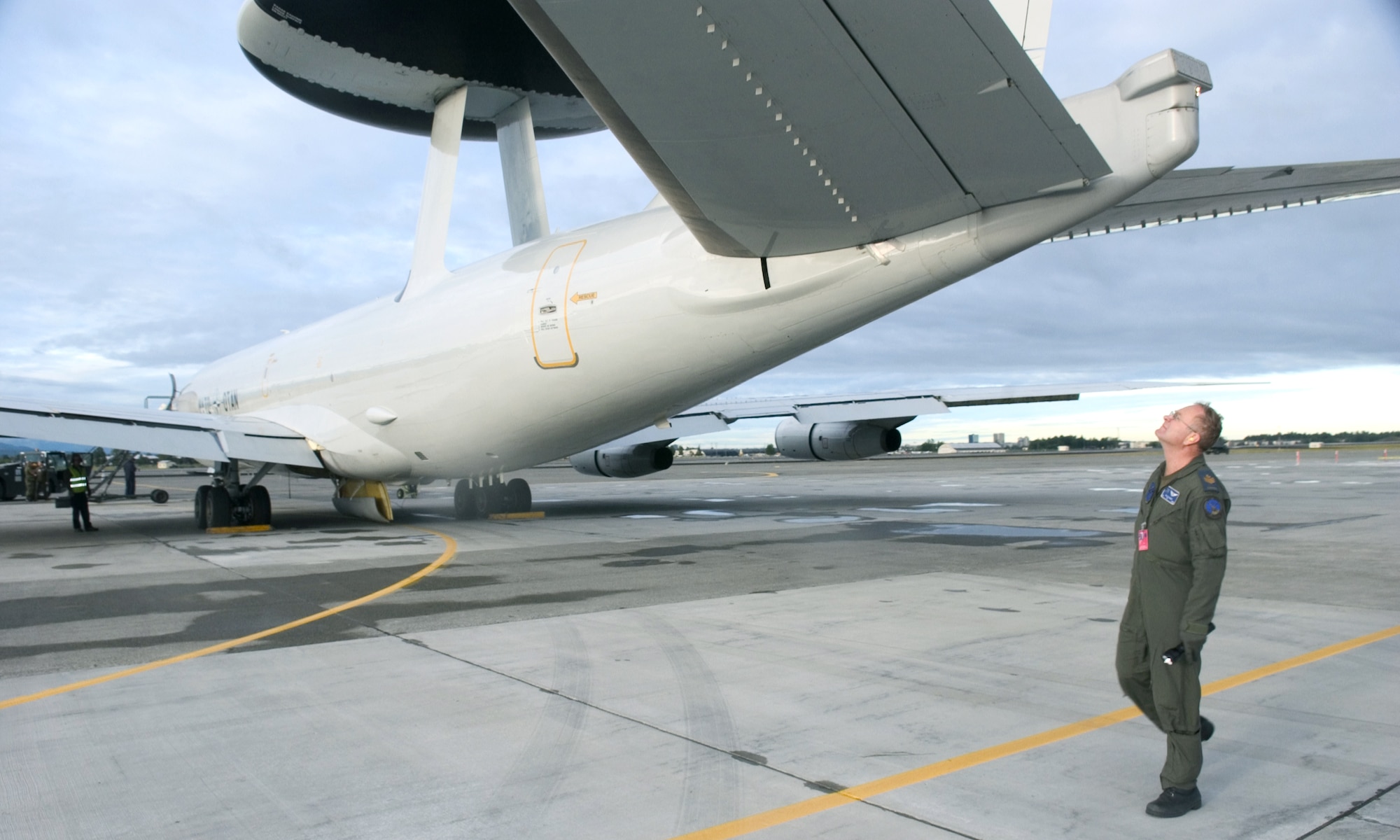 Master Sgt. Dale Fisher conducts a pre-flight check July 26 on a NATO E-3 Airborne Warning And Control System aircraft at Elmendorf Air Force Base, Alaska.  The aircraft and crew are participating in Cooperative Cope Thunder, a multinational exercise taking place in Alaska.  Sergeant Fisher is an AWACS flight engineer.  (US Air Force Photo/Senior Airman Garrett Hothan)