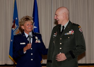 Maj Gen Elizabeth A. Harrell, Director of Maintenance and Logistics, Air Combat Command, shares a moment with her fiance, Maj Gen William Grisoldi, Commander, US Army Corps of Engineers, during her retirement ceremony.  Maj Gen Harrell is retiring after 30 years of service.  (USAF photo by TSgt Elizabeth Weinberg)  