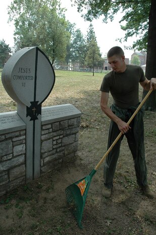 Sgt. James E. Stauffer of Searsport, Maine, a Headquarters Battalion platoon sergeant with Chemical Biological Incident Response Force, II Marine Expeditionary Force, clears storm debris from St. Vincent Home for Children grounds, Aug . 7. High winds thrashed the home's grounds during recent storms in the St. Louis area. The CBIRF Marines and sailors were in St. Louis supporting a large-scale civilian exercise, testing the county's first responders to disaster situations.