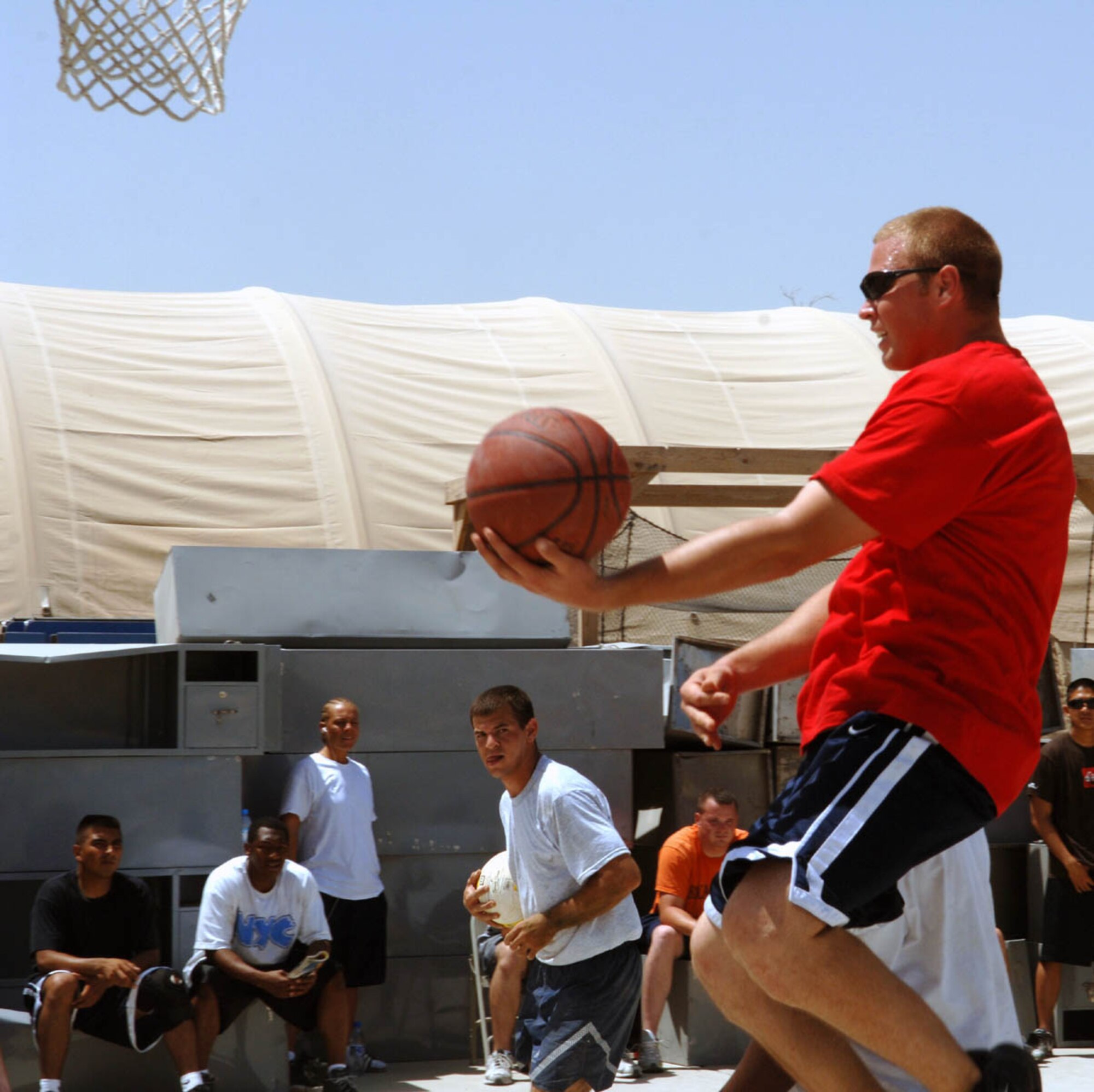 A basketball player goes in for an easy layup during Sports Day here Aug. 6. The 755th Security Forces Squadron placed first in basketball. SFS was also named the overall champs. (U.S. Air Force photo by Master Sgt. Orville F. Desjarlais Jr.) 