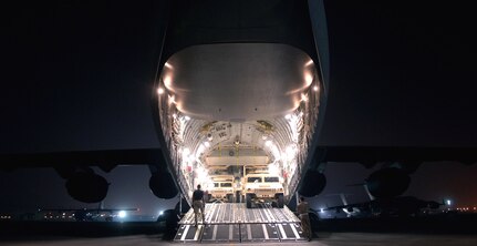 A C-17 Globemaster III is loaded with cargo at a forward operating base in Southwest Asia on Aug. 5. The C-17 is with the 816th Expeditionary Airlift Squadron. The squadron flew more than 1,200 sorties in July, delivering cargo and troops in support of operations Iraqi Freedom and Enduring Freedom. (U.S. Air Force photo/Senior Airman Brian Ferguson)
