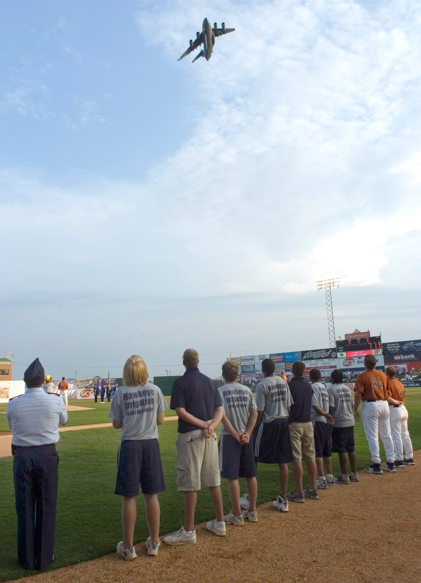 A C-17 Globemaster III from Altus Air Force Base, Okla., flies over the opening ceremonies of the Gateway Grizzlies minor league baseball game in Sauget, Ill., on Aug. 8. Air Force night at the ballpark featured special admissions and promotions for Airmen. The event was one of several activities taking place in the greater St. Louis area celebrating Air Force Week. (U.S. Air Force photo/Master Sgt. Jack Braden)