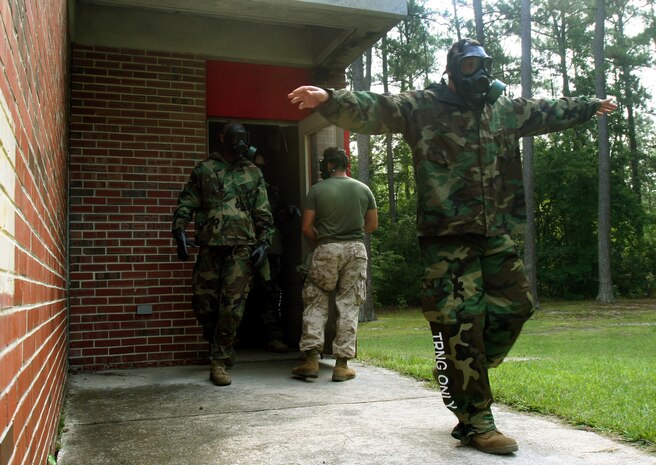 Chemical Biological Incident Response Force's Technical Rescue Platoon talks St. Louis firefighter Tony Taylor through unlocking the prusik knot which has left him dangling more than 100 feet above the pavement, Aug. 8. Taylor said that training with the Marines has reinforced his faith in their abilities. CBIRF, of II Marine Expeditionary Force, traveled to St. Louis to train with the areas crisis management first responders.