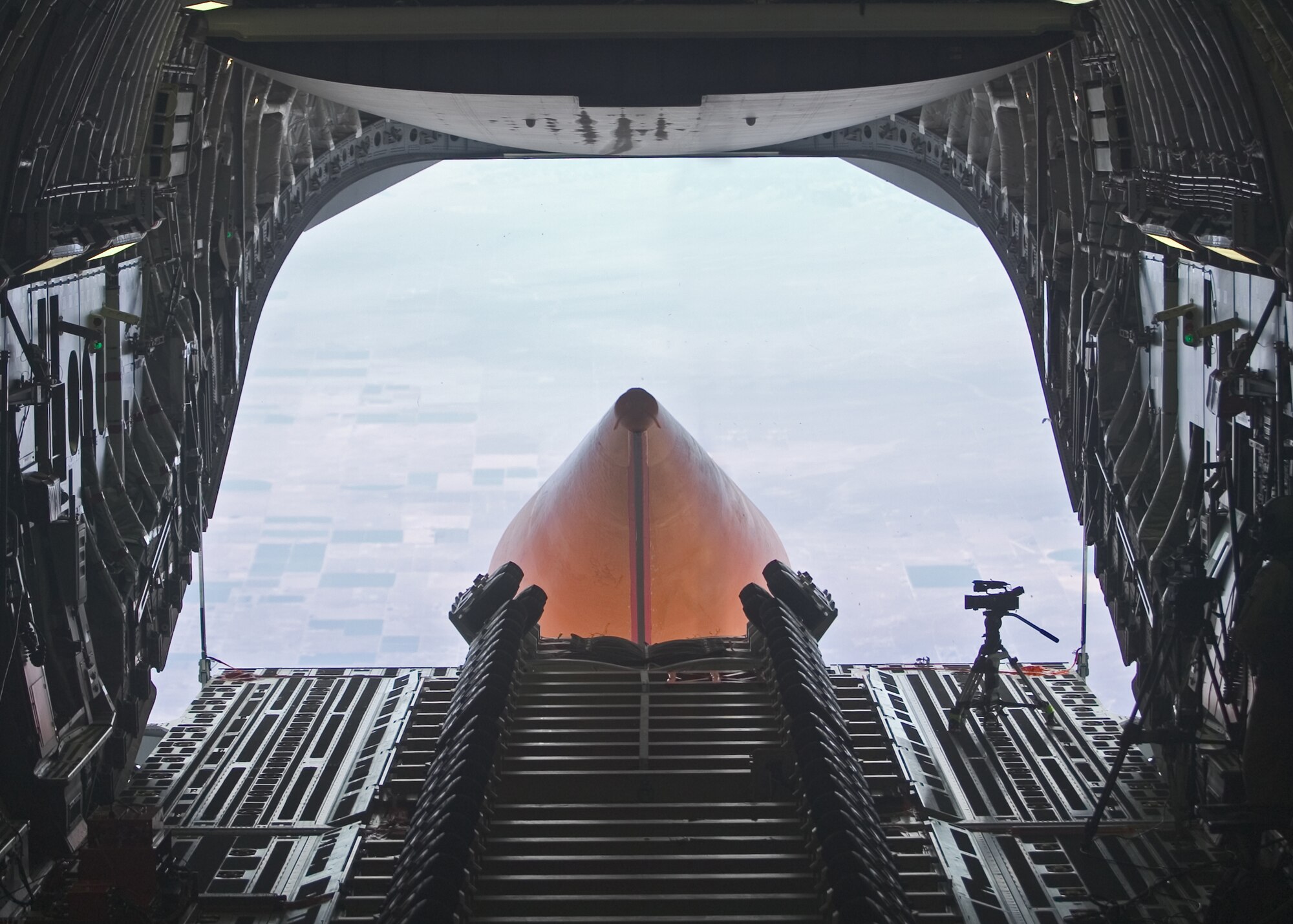 AirLaunch Drop Test Article exits a C-17 at 32,000 feet, during a late-July test.  (Air Force photo by Jim Shryne)