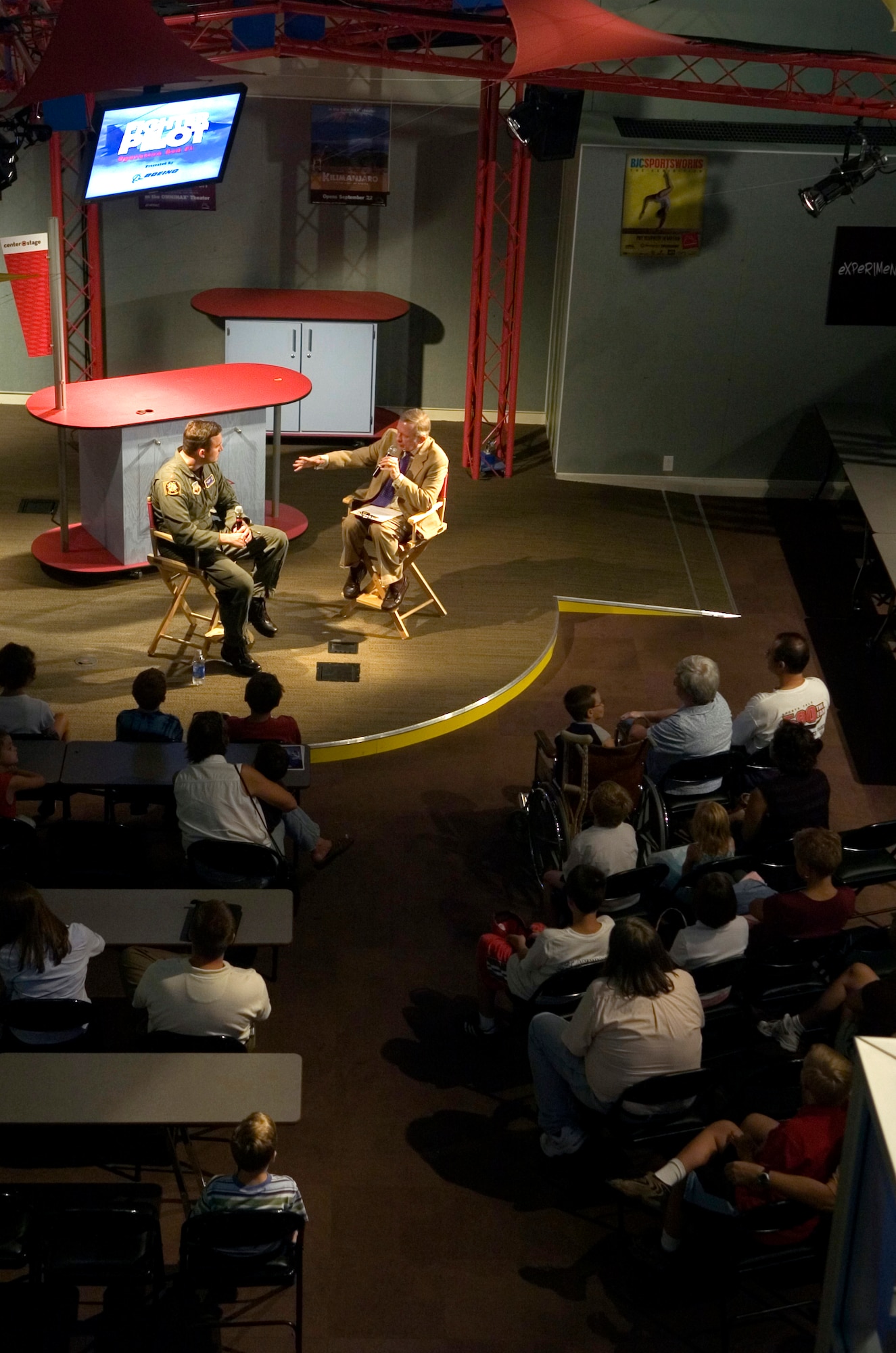 Maj. Robert Novotney, the "Air Boss" in the IMAX film "Fighter Pilot," is interviewed at the St. Louis Science Center on Aug. 9 about a being an Air Force fighter pilot. The event was one of several activities taking place in the greater St. Louis area celebrating Air Force Week. Major Novotney is a student attending the School of Advanced Air and Space Studies at Maxwell Air Force Base, Ala. (U.S. Air Force photo/Master Sgt. Jack Braden) 
