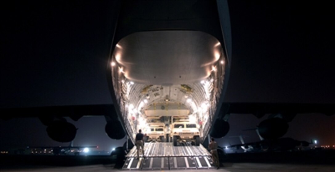 U.S. Air Force airmen load humvees into a C-17 Globemaster III aircraft in Southwest Asia on Aug. 5, 2006, for transport to Bagram, Afghanistan.  The C-17 is attached to the 816th Expeditionary Airlift Squadron. 
