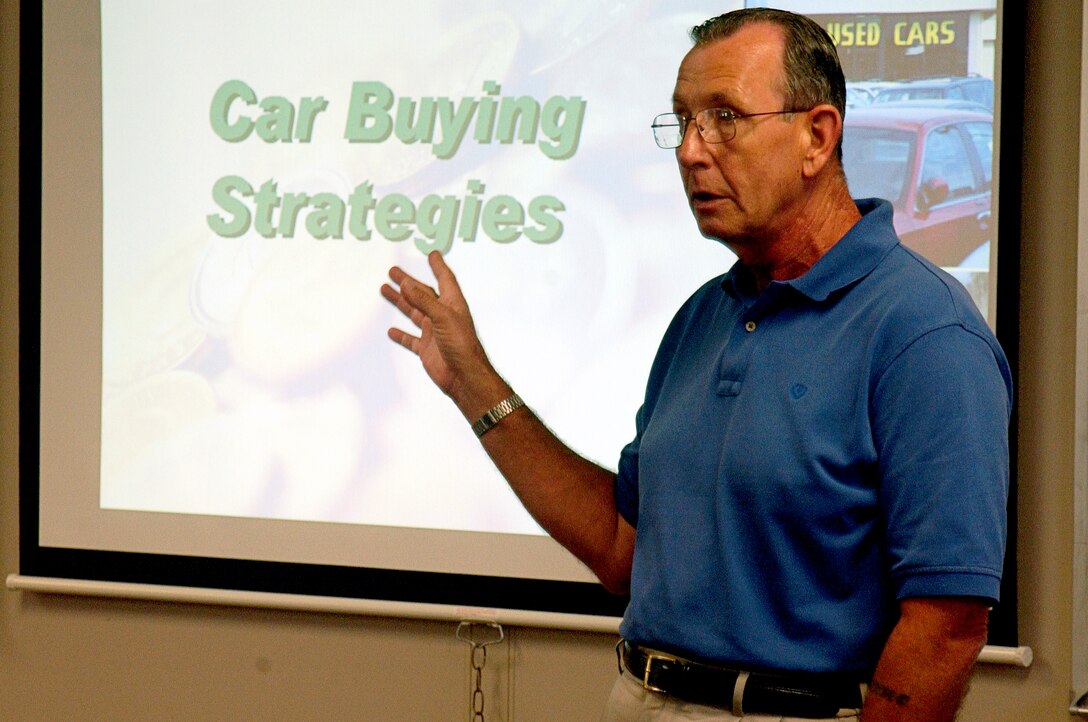 MARINE CORPS BASE CAMP LEJEUNE, N.C. - Roy Ells, the financial specialist for the Health Promotions Office of Marine Corps Community Services, explains how to get a fair deal on a car here Aug. 10 at one of his classes. Ells has been serving the Marine Corps for 36 years. After his retirement in 1996, Ells has helped Marines to keep control of their finances and make wise decisions. (Official U.S. Marine Corps photo by Lance Cpl. Brandon R. Holgersen)(released)