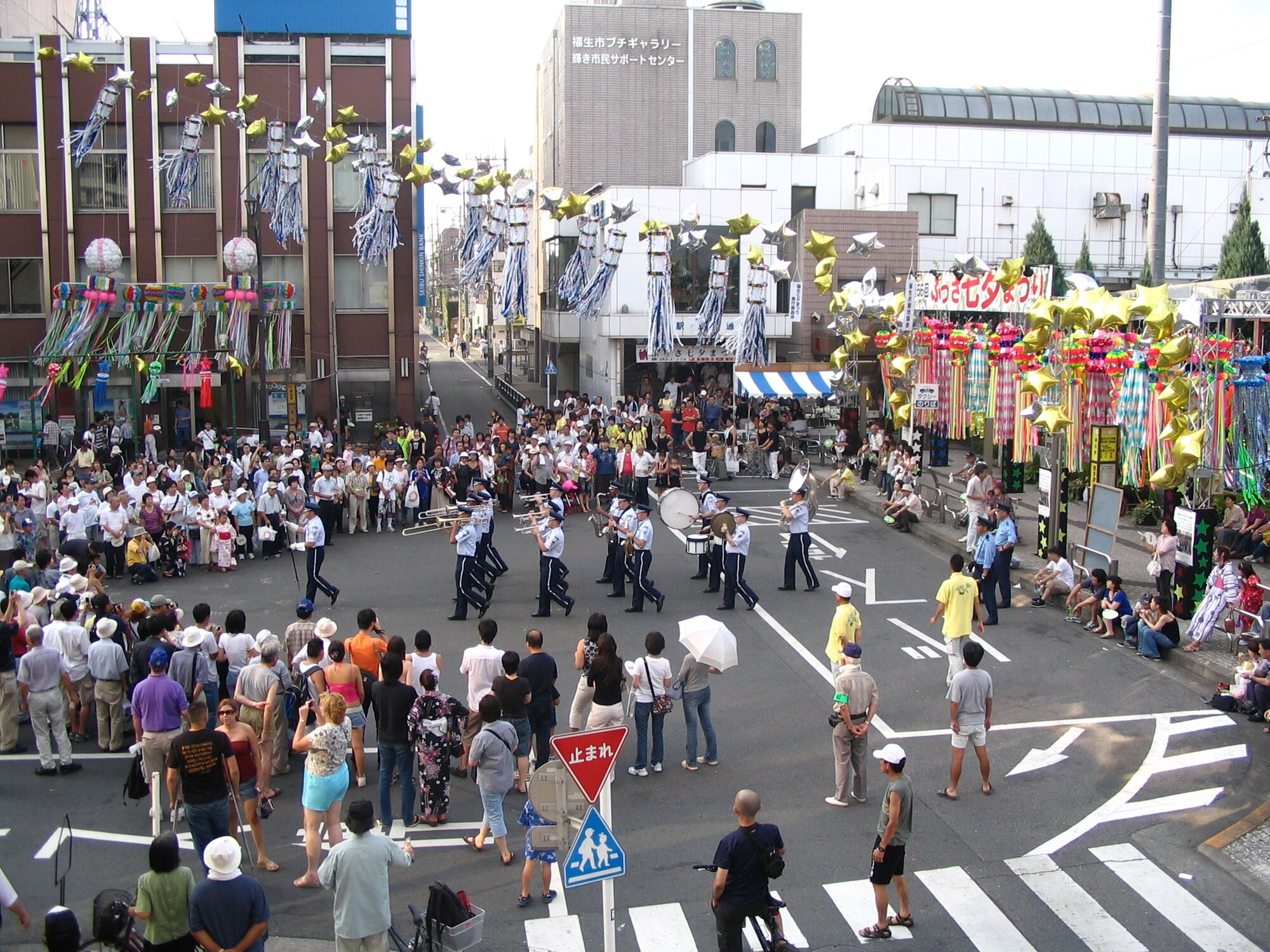 FUSSA-SHI, Japan -- The Pacific Air Forces band Pacific Trends marches through the streets of Fussa-shi, Japan, during The Tanabata Festival.  Tanabata, also known as the "star festival", takes place on the 7th day of the 7th month of the year, when, according to a Chinese legend, the two stars Altair and Vega, which are usually separated from each other by the milky way, are able to meet.  Pacific Trends performs at the annual Tanabata Festival in an act of friendship and continued community support.