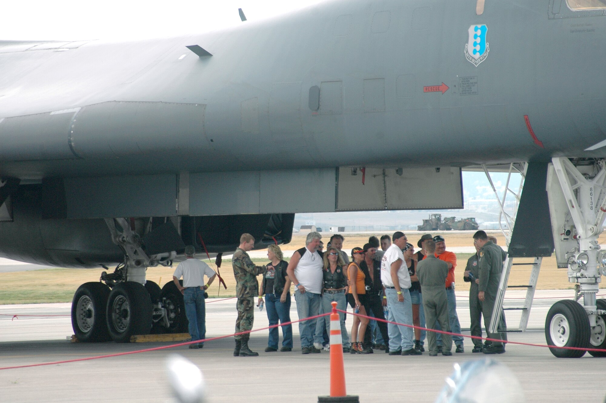 Members of the Ellsworth Dakota Thunder Motorcycle Club speak with aircrew members of a B-1 Lancer at Ellsworth Air Force Base, S.D., on Aug. 8. Members of the local motorcycle club also had a chance to park their motorcycles in front of the aircraft for photo opportunities. Following the tour, nearly 200 riders from Ellsworth and the surrounding communities began their annual ride to the 66th Annual Sturgis Motorcycle Rally, which lasts through Aug. 13 at nearby Sturgis. (U.S. Air Force photos/Airman Kimberly Limrick) 
