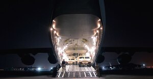 Humvees are loaded onto a C-17 Globemaster III at a forward operating base in Southwest Asia.  The C-17 is with the 816th Expeditionary Airlift Squadron. The squadron flew more than 1,200 sorties in July, delivering cargo and troops in support of operations Iraqi Freedom and Enduring Freedom. (U.S. Air Force photo/Senior Airman Brian Ferguson)

