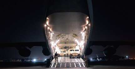 Humvees are loaded onto a C-17 Globemaster III at a forward operating base in Southwest Asia.  The C-17 is with the 816th Expeditionary Airlift Squadron. The squadron flew more than 1,200 sorties in July, delivering cargo and troops in support of operations Iraqi Freedom and Enduring Freedom. (U.S. Air Force photo/Senior Airman Brian Ferguson)

