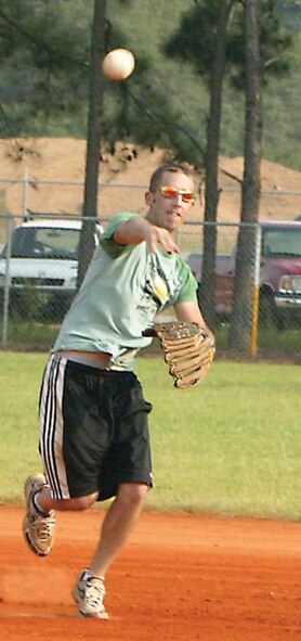 Airman 1st Class Justin Kratzer, 20th SFS, throws the ball to first base and gets the runner out.  (U.S. Air Force photo/Senior Airman John Gordinier)
