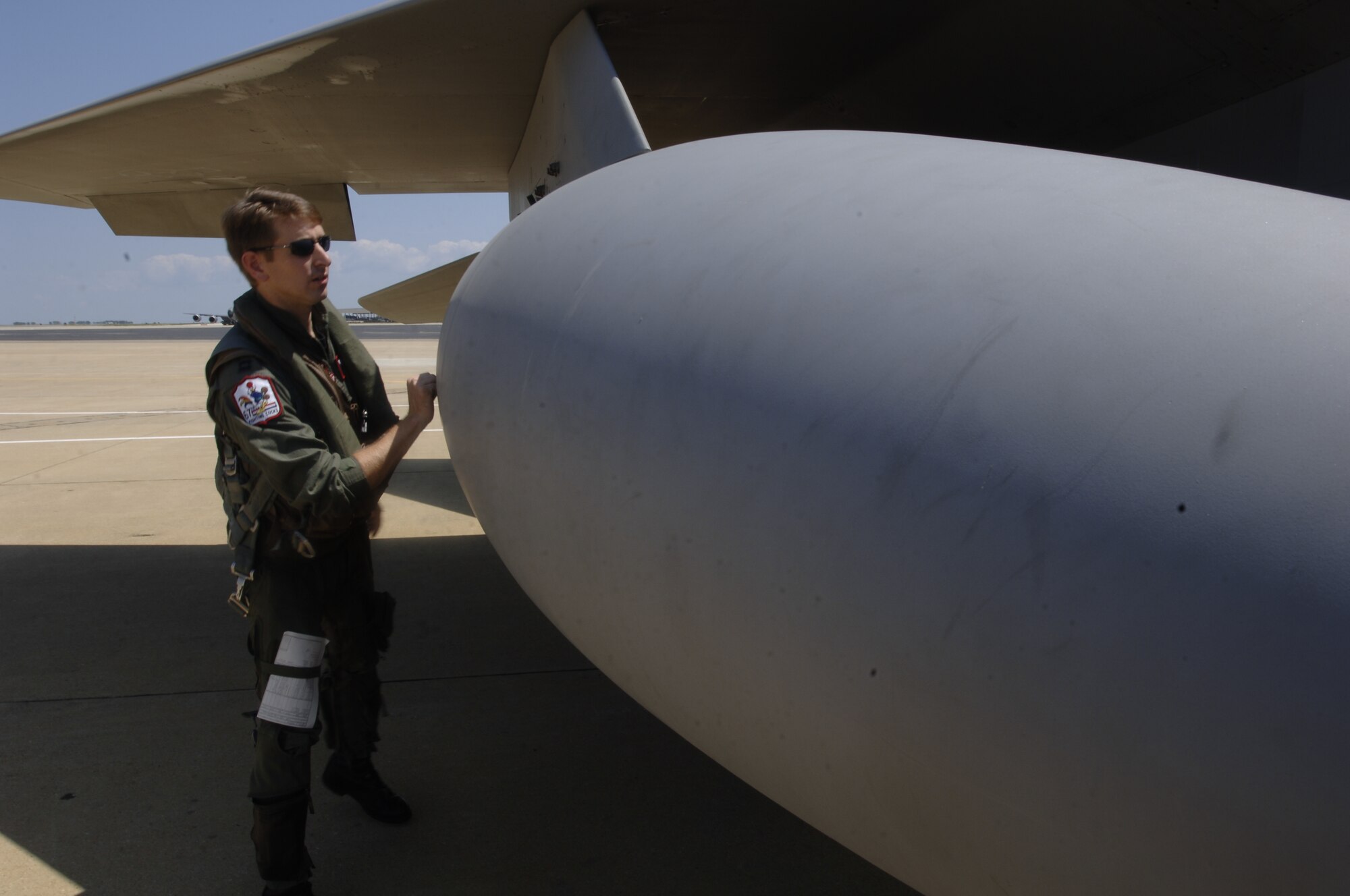 Capt. John Deline, 67th Fighter Squadron, inspects his F-15 Eagle before leaving for Kadena AB, Japan,  Wednesday. (Photo by Airman 1st Class Christopher L. Ingersoll)