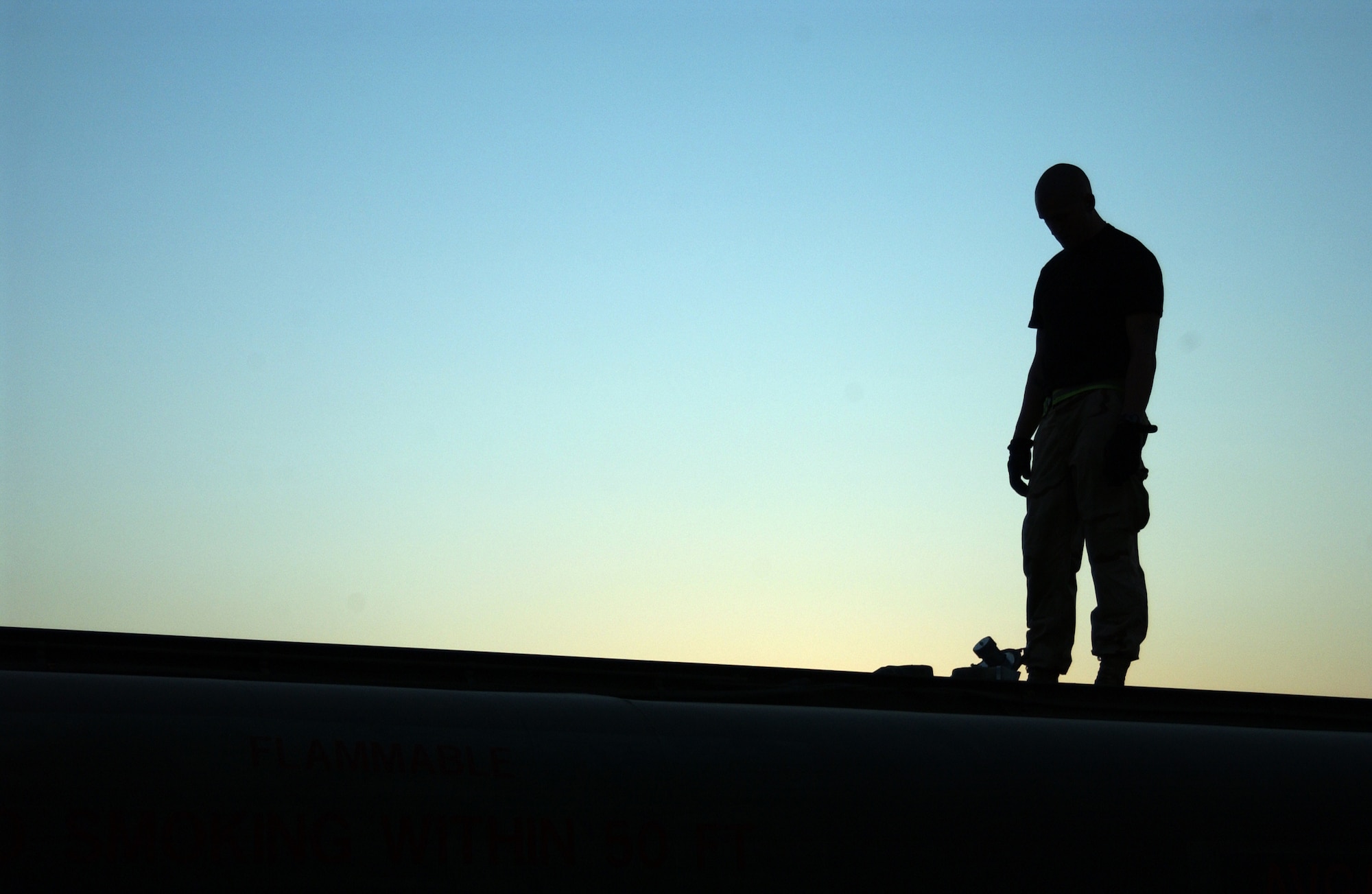 Staff Sgt. Anthony Howell monitors the filling of a fuels truck with AVGAS.  The fuels flight of the 332nd ELRS pumps 12 million gallons of gas every four months. (U.S. Air Force photo/Senior Airman Kerry Solan-Johnson)