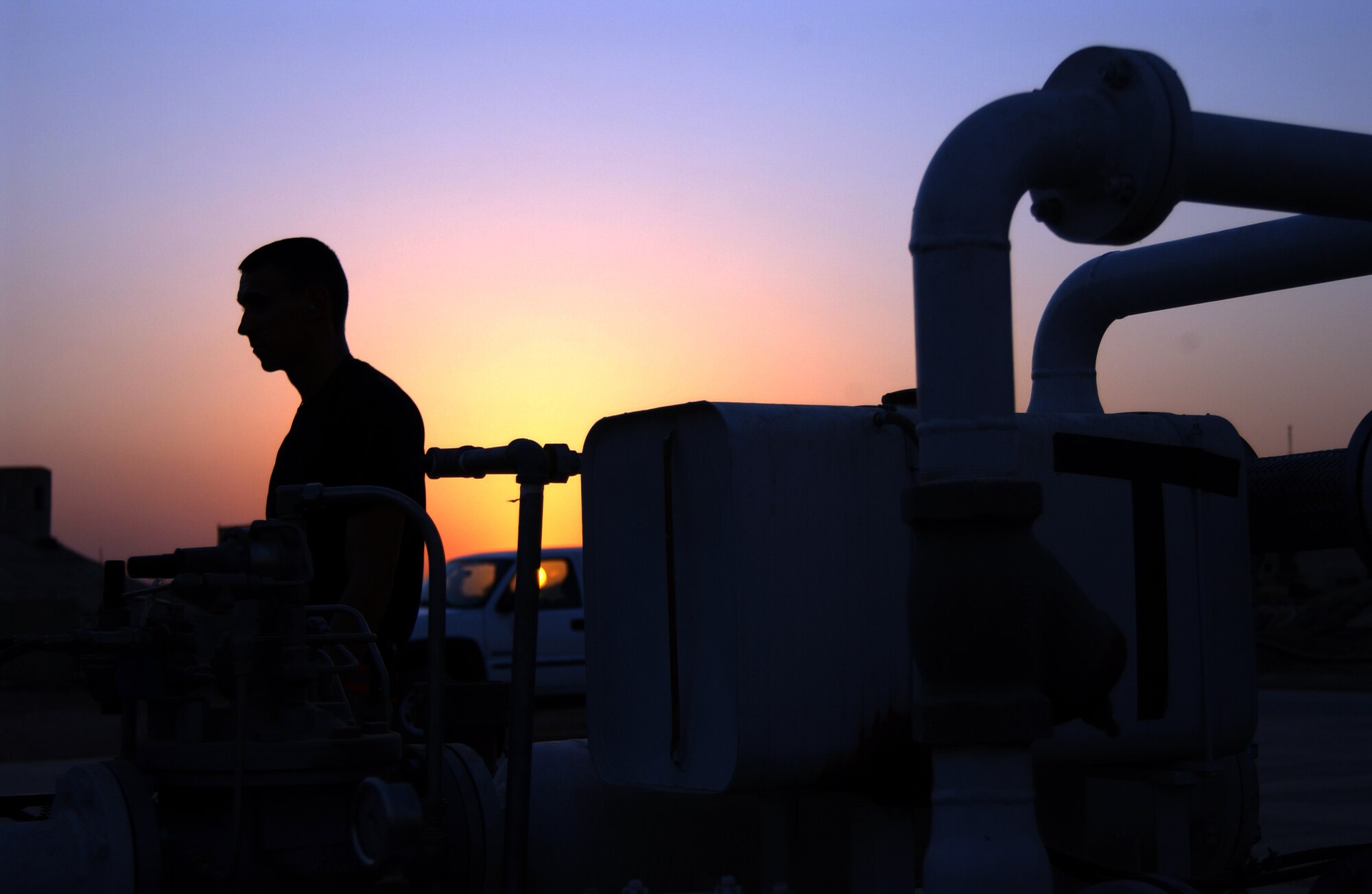 BALAD AIR BASE, Iraq -- Staff Sgt. William Ryan, 332nd Expeditionary Logistics Readiness Squadron, oversees the aviation gas system his flight installed during their Air Expeditionary Force rotation here. The fuels flight of the 332nd ELRS pumps 12 million gallons of gas every four months. (U.S. Air Force photo/Senior Airman Kerry Solan-Johnson)