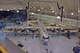 HILL AIR FORCE BASE, Utah — An aerial view shows how the work stand is fitted around the C-130s wing and tail area. The black tubing above brings fresh-air heating and cooling to the work area, reducing ground clutter around the aircraft. (Air Force photo by Tom Whitney)