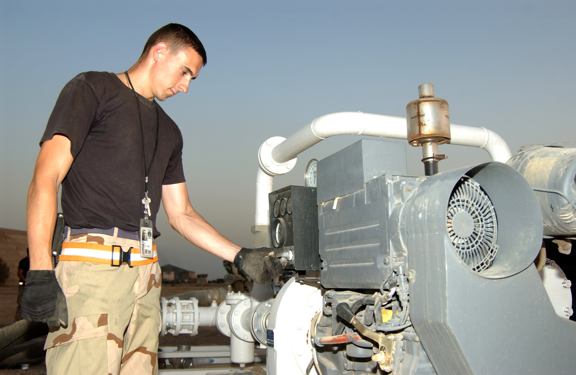 BALAD AIR BASE, Iraq -- Staff Sgt. William Ryan, 332nd Expeditionary Logistics Readiness Squadron, oversees the aviation gas system his flight installed during their Air Expeditionary Force rotation here. The fuels flight of the 332nd ELRS pumps 12 million gallons of gas every four months. (U.S. Air Force photo/Senior Airman Kerry Solan-Johnson)                               