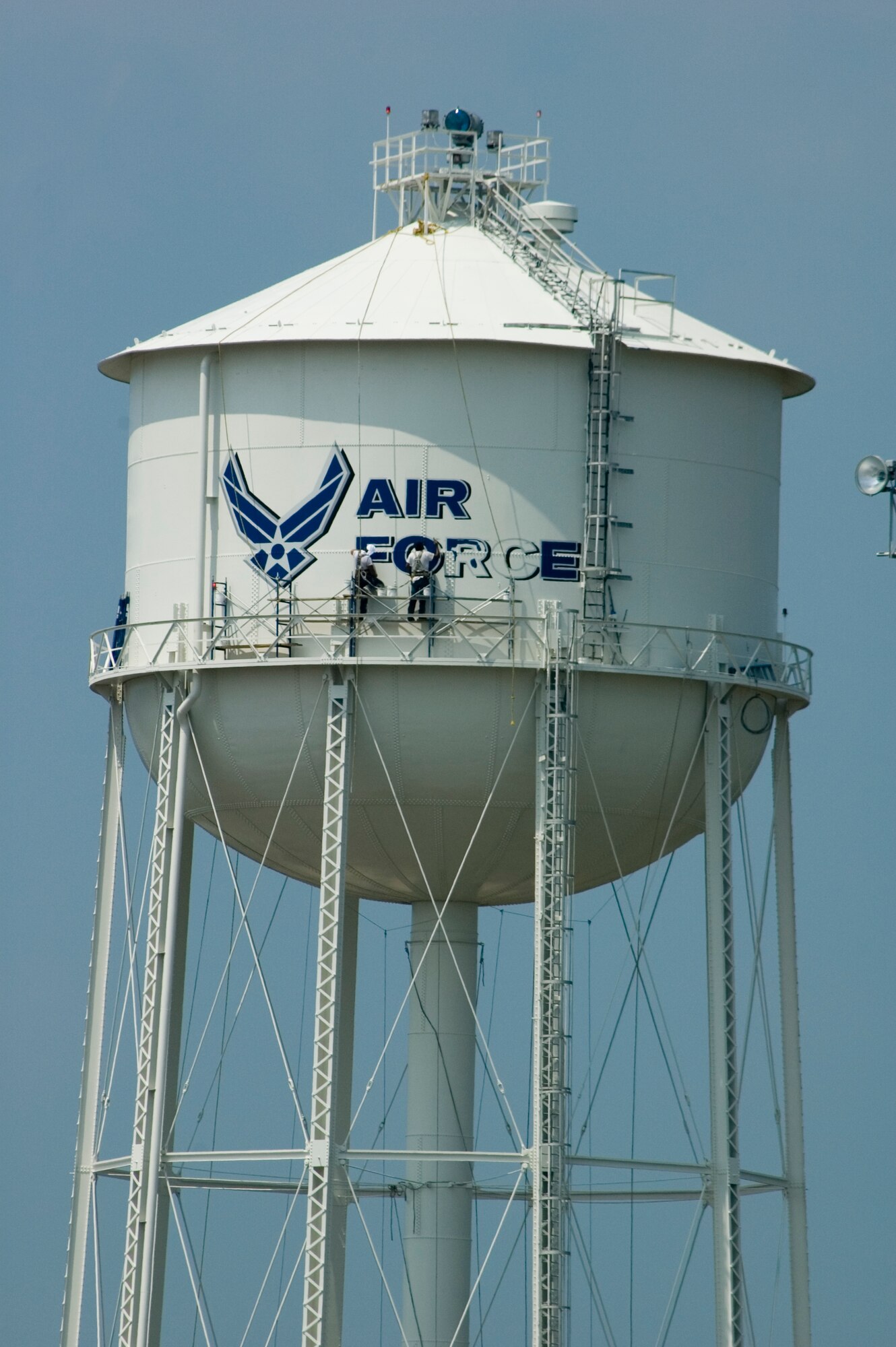 Contractors paint Westover's 1940's-era water tower under scorching heat Aug. 2.  The repainting was a base civil engineering project aimed at prolonging the life of the tower.  The 500,000 gallons of water in the tower supplement the base water supply in caser of fire.  Workers completed the project Aug. 3. 
