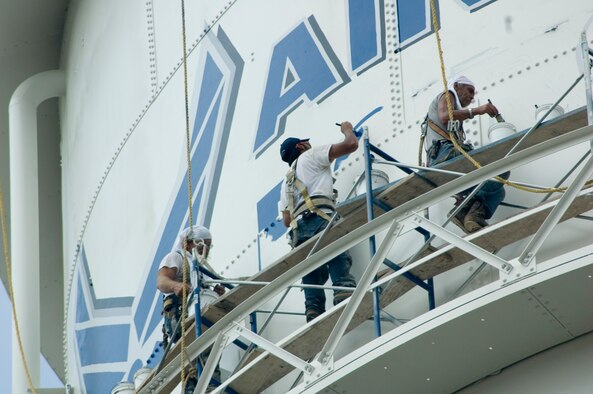 Contractors paint Westover's 1940's-era water ttower under scorching heat Aug. 2.  The repainting was a base civil engineering project aimed at prolonging the life of the tower.  The 500,000 gallons of water in the tower supplement the base water supply in caser of fire.  Workers completed the project Aug. 3. 