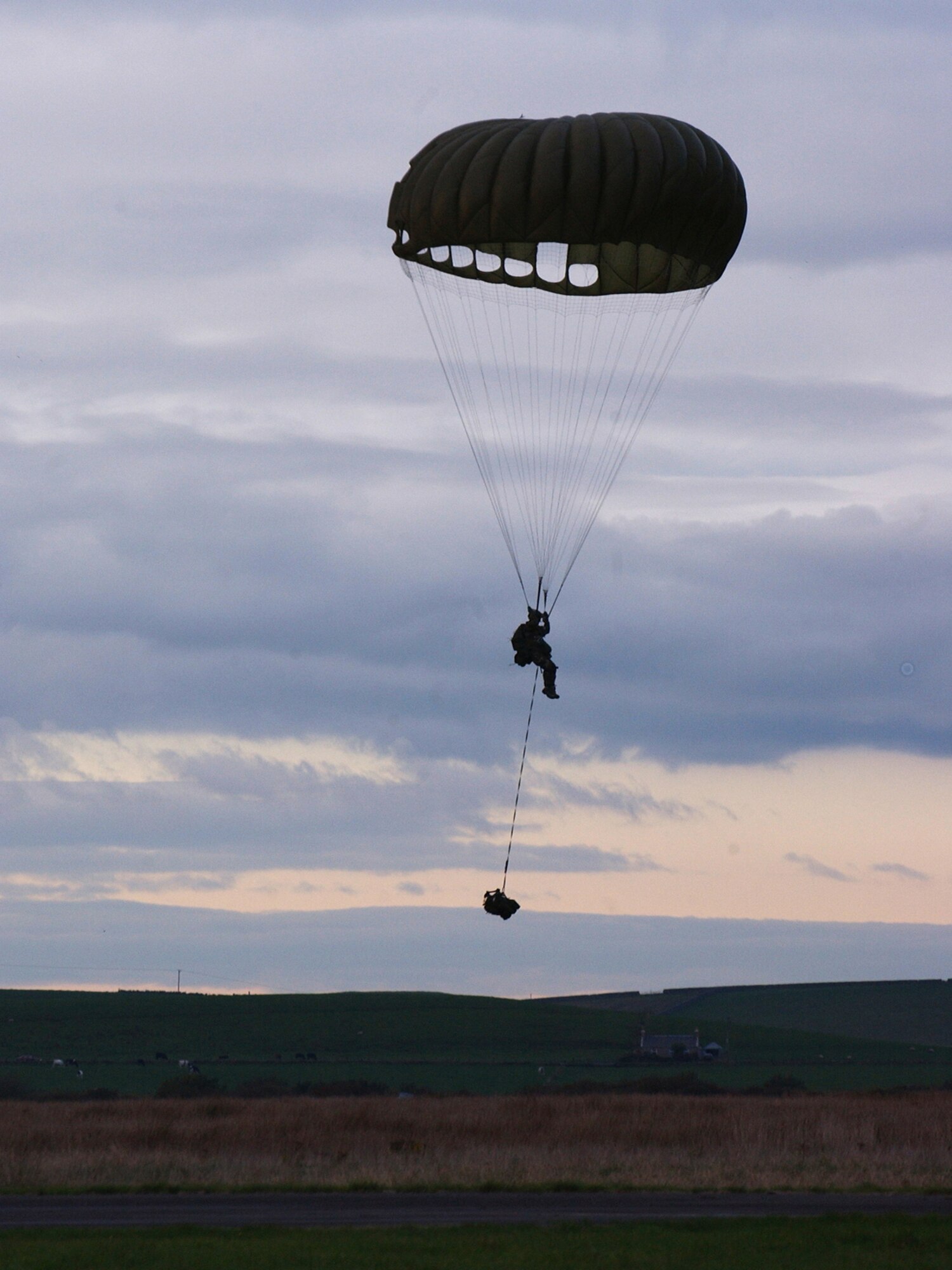 A Moody pararescueman prepares to land in his designated drop zone. PJs go through intense training to be effective in search and rescue operations. Static line jumps allow the PJ to jump from aircraft at lower altitudes. (U.S. Air Force photo/Tech. Sgt. Rob Jensen)