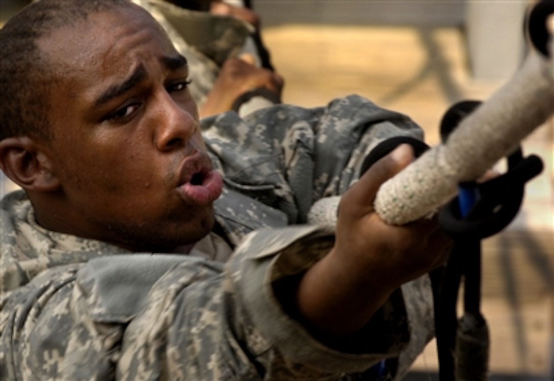 A U.S. Army private competes in the victory tower course during Army basic training at Fort Jackson, S.C., Aug. 9, 2006. 