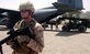 Senior Airman Charles Coles stands guard while a C-130 Hercules is unloaded at a remote airstrip near Farah, Afghanistan, on Aug. 10. Airman Coles is part of the 455th Expeditionary Security Forces Squadron's Fly-Away Security Team, which provides security for aircraft wherever they land in support of Operation Enduring Freedom. (U.S. Air Force photo/Maj. David Kurle)