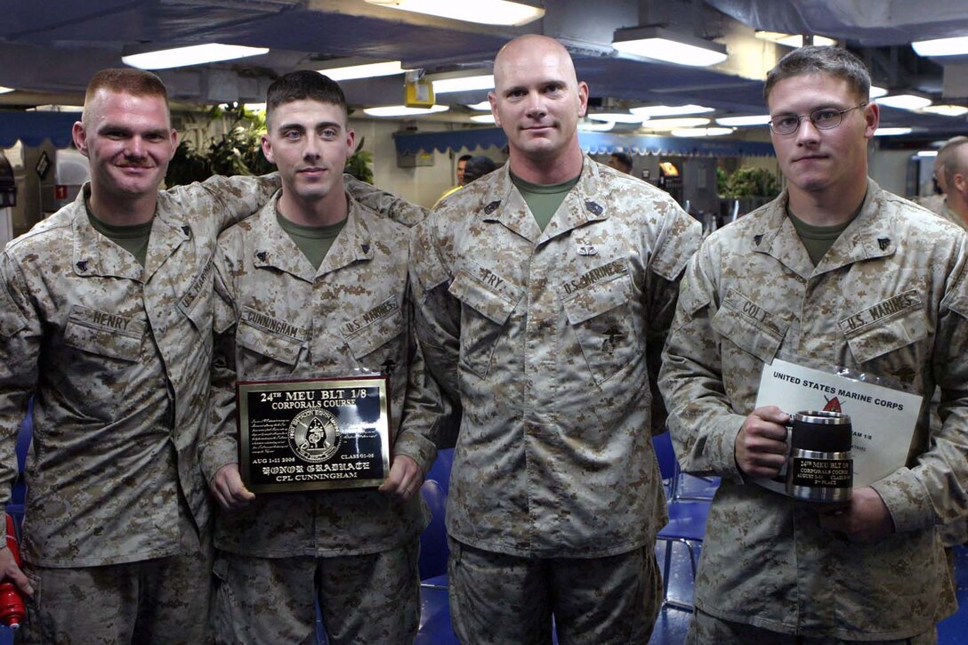 While on board the USS Iwo Jima Marines take part in Corporal's Course Graduation on the mess deck on ship. This course gives Marines a chance to become prepared for responsibilities and situations that come with being a Non-Commissioned Officer (NCO) in the United States Marine Corps (USMC). (US Marine Corps photo by Lance Corporal Andrew J. Carlson)