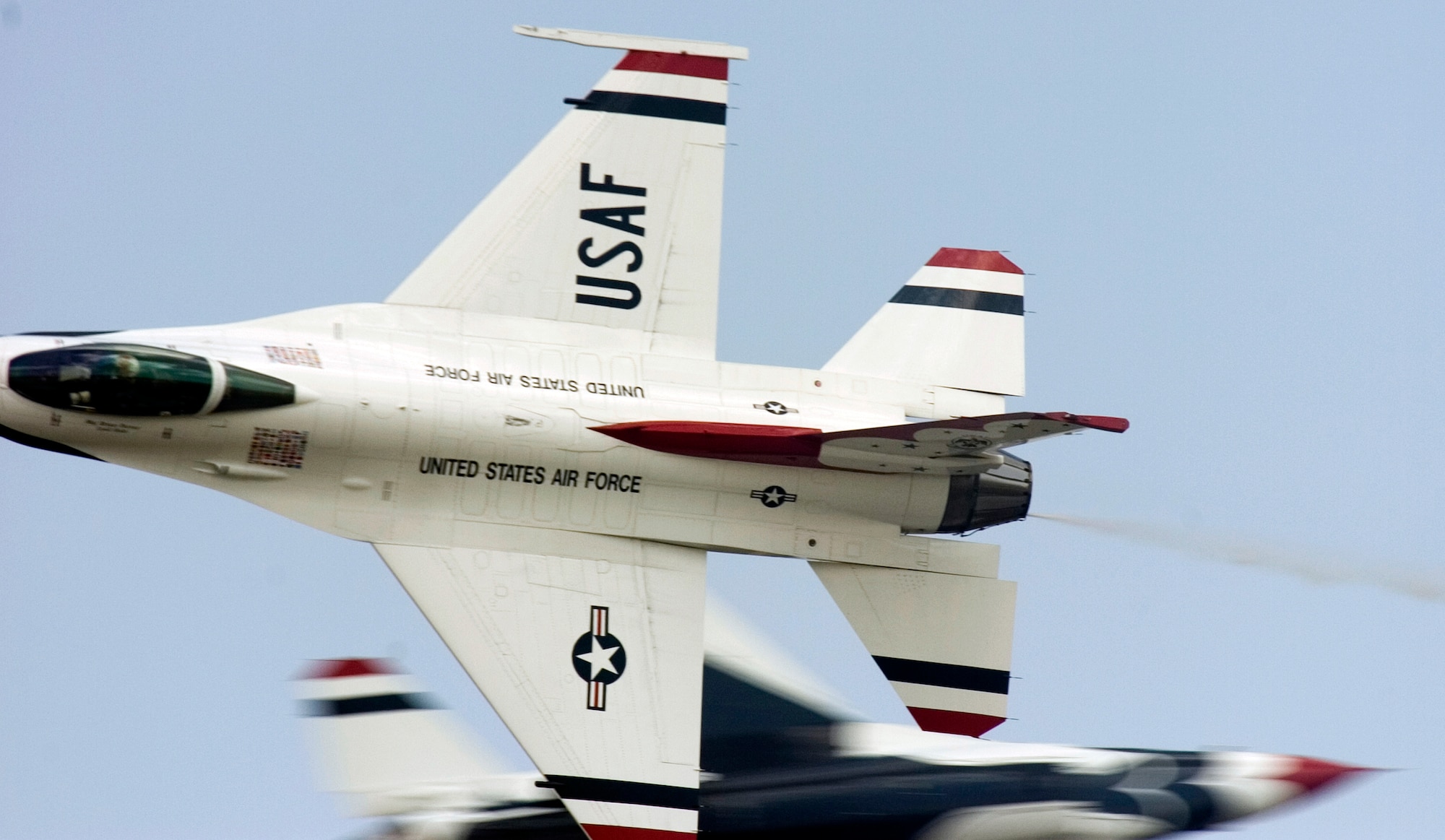 Thunderbirds No. 5 and 6 pass perform an opposing knife pass during a practice show at Scott Air Force Base, Ill., on Aug. 11. (U.S. Air Force photo/Master Sgt. Jack Braden)