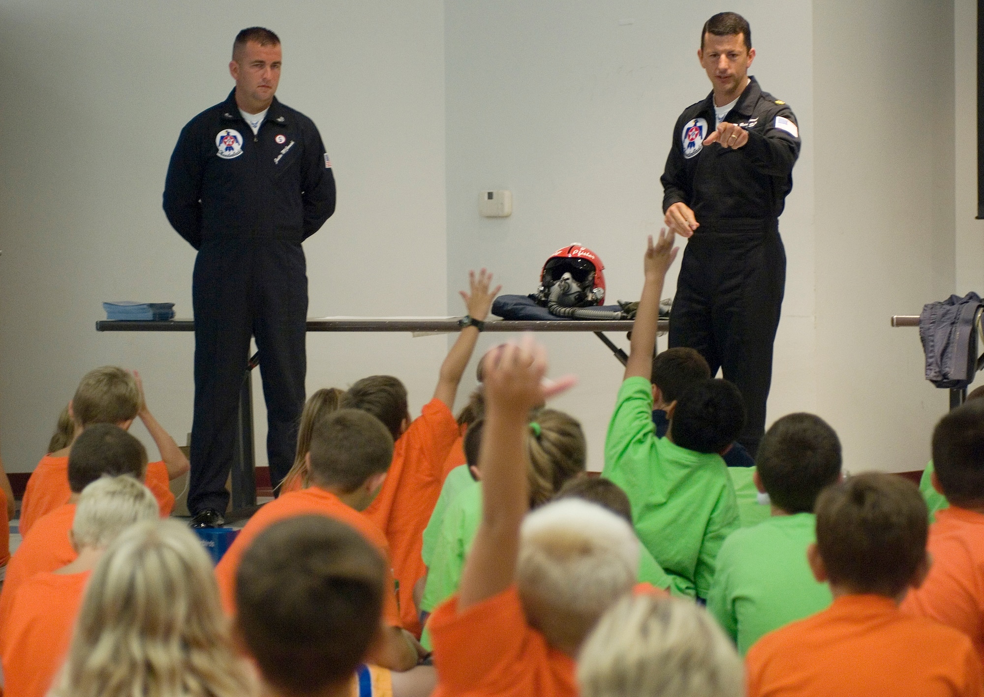 Maj. Brian Farrar and Staff Sgt. Justin McCormick of the Thunderbirds, the U.S. Air Force Air Demonstration Squadron, answer questions about what it is like to be in the Air Force and be a Thunderbird. Major Farrar is Thunderbird No. 5 and lead solo. Sergeant McCormick is crew chief on the No. 5 aircraft. The camp visit was part of Air Force Week community activities in the St. Louis area. (U.S. Air Force photo/Master Sgt. Jack Braden) 

