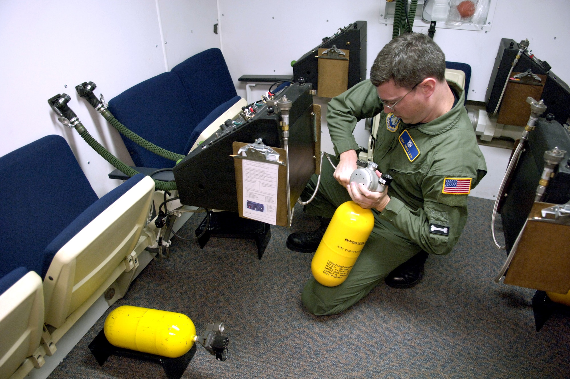 Staff Sgt. James Ray fills a walk around air bottle in preparation for a physiological training class at Peterson Air Force Base, Colo., on Aug. 9. Sergeant Ray is an aerospace physiological technician with the 21st Aerospace Medical Squadron. (U.S. Air Force photo/Tech. Sgt. Shane A. Cuomo)