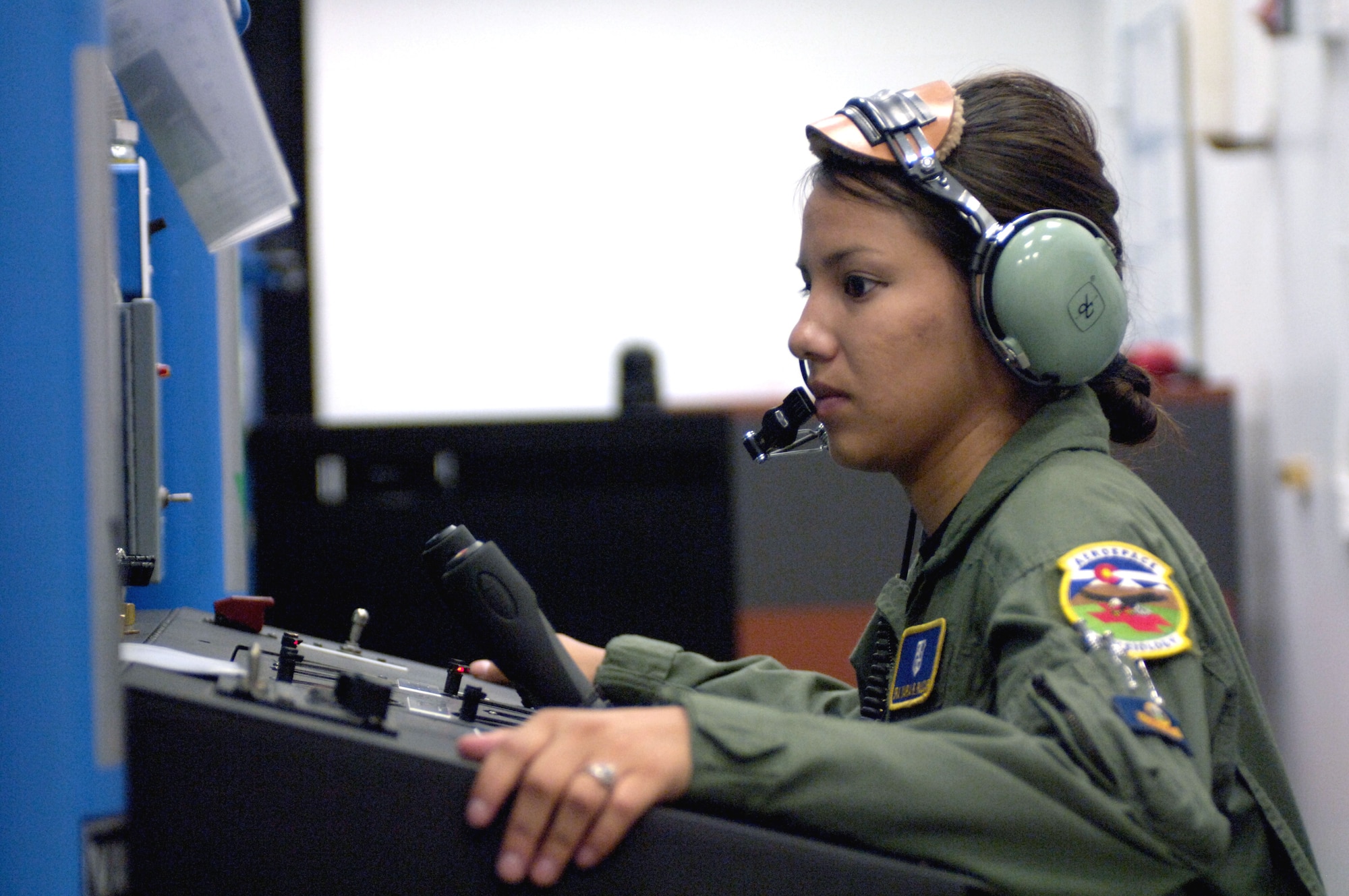 Senior Airman Maria Paucar tests the altitude chamber to prep it for a physiological training class at Peterson Air Force Base, Colo., on Aug. 9. Airman Paucar is an aerospace physiological technician with the 21st Aerospace Medical Squadron. (U.S. Air Force photo/Tech. Sgt. Shane A. Cuomo)