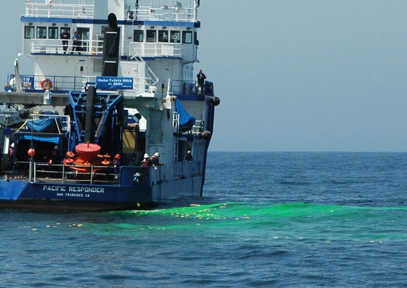 THE GULF OF THE FARALLONES -- Marine Spill Response Corporation crew members of the vessel Pacific Responder throw drift cards onto a simulated oil slick in preparation for the Safe Seas 2006 Oil Spill Response Exercise held Aug 9.  The cards are tracked during and after the exercise to record the speed and direction an oil slick would travel. An Air Force Reserve C-130H assigned to the 910th Airlift Wing at Youngstown Air Reserve Station, Ohio targeted the slick spraying a simulated dispersant over it as part of the exercise.  U.S. Air Force photo/Capt. Brent Davis