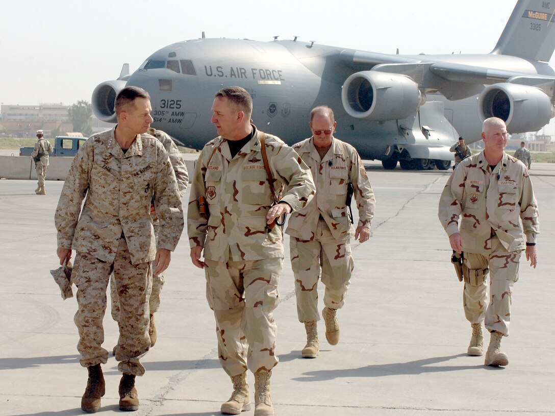 SATHER AIR BASE, Iraq -- Colonel Ron Rutland, 447th Air Expeditionary Group commander, describes his unit's mission to Marine Gen. Peter Pace, Chairman of the Joint Chiefs of Staff, after the general arrived at Sather Air Base Aug. 12. While Colonel Rutland is the 447 AEG commander here, he is the 512th Airlift Wing commander at Dover Air Force Base, Del. (Photo by Staff Sgt. Bryan Bouchard)