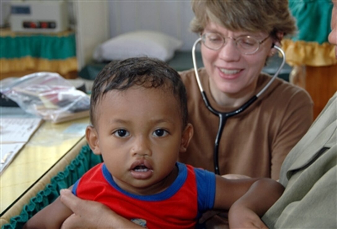 U.S. Air Force Maj. Valerie Clegg examines a young boy at the provincial hospital in Tarakan, Indonesia, during a humanitarian assistance visit, Aug. 12, 2006. Clegg is a pediatrician deployed on the hospital ship USNS Mercy, which is in the fourth month of a five-month humanitarian and civic assistance deployment to South and Southeast Asia. 