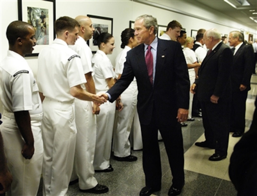 President George W. Bush shakes hands with sailors after his meeting and lunch with Secretary of Defense Donald H. Rumsfeld and his national security team in the Pentagon on Aug. 14, 2006.  Vice President Dick Cheney, Secretary of State Condoleezza Rice, Chairman of the Joint Chiefs of Staff Gen. Peter Pace, U.S. Marine Corps, and Deputy Secretary of Defense Gordon England joined Bush and Rumsfeld to discuss the way ahead in Iraq and the war on terror.  