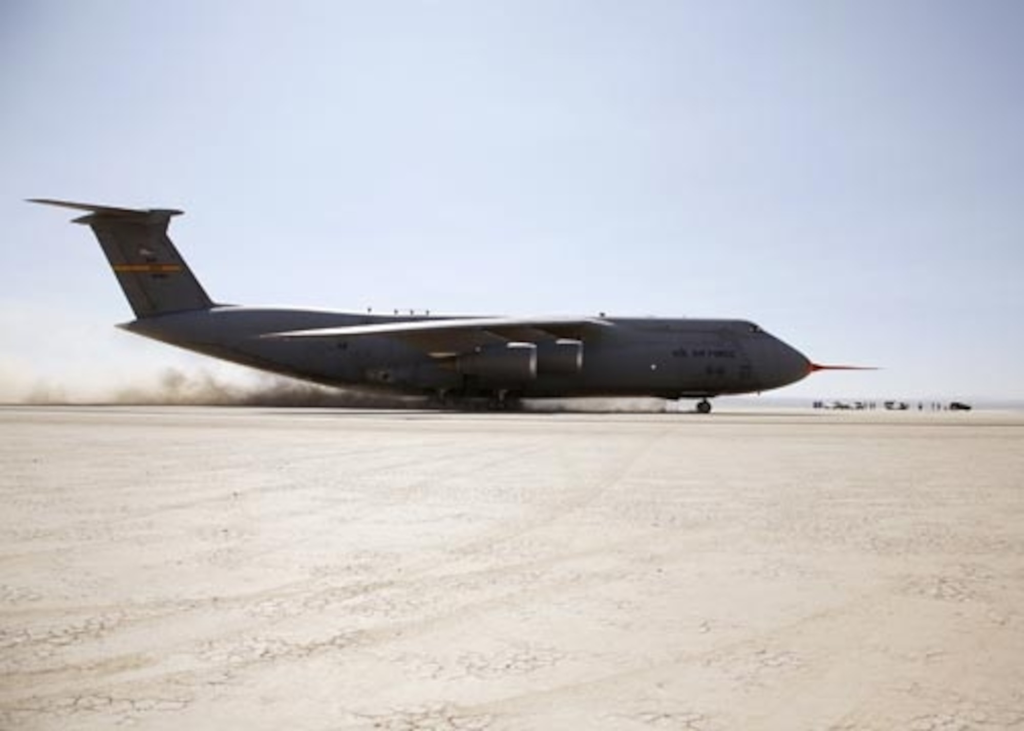 A C-5 Galaxy taxis across a series of ramps on Rogers Dry Lakebed, Calif., on Aug. 2 as part of the C-5's Reliability Enhancement and Re-engining Program. The dynamic tests are designed to evaluate the structural modes of the aircraft with newer jet engines installed. (U.S. Air Force photo/Jet Fabara)