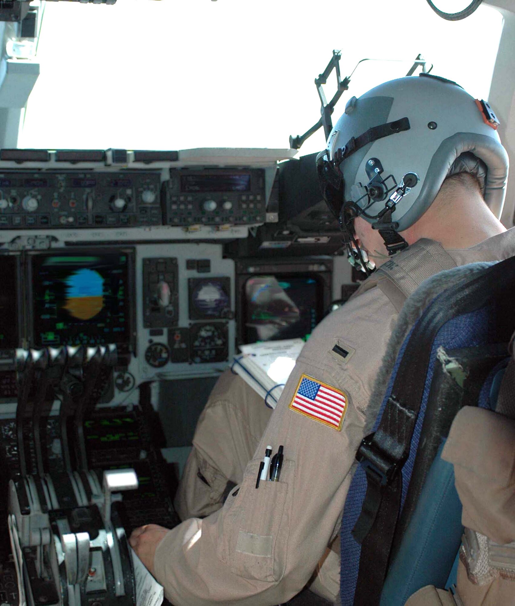 First Lt. Steven Byrum makes altitude adjustments during an Operation Enduring Freedom mission over Southwest Asia on Aug. 8. He is a C-17 Globemaster III pilot with Detachment 1 of the 817th Expeditionary Airlift Squadron. (U.S. Air Force photo/Staff Sgt. Candy Knight)