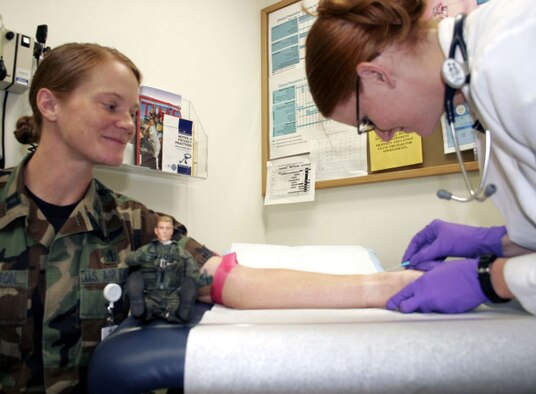 Viper watched as Victoria Olvera, 366th Medical Operations Squadron nurse practitioner, prepares to put an IV in the arm of Capt. Karrn Gustafson Tuesday afternoon. The 366th Medical Group takes care of all the Gunfighter's medical needs to ensure they are mission ready.