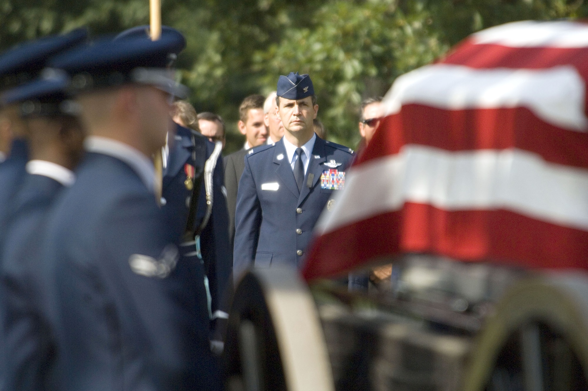 Col. John D. Posner walks behind the casket of his father, retired Maj. Gen. Jack I. Posner, at Arlington National Cemetery on Aug. 11. General Posner was among the last bomber pilots to have served in World War II. (U.S. Air Force photo/Tech. Sgt. Cohen A. Young) 
