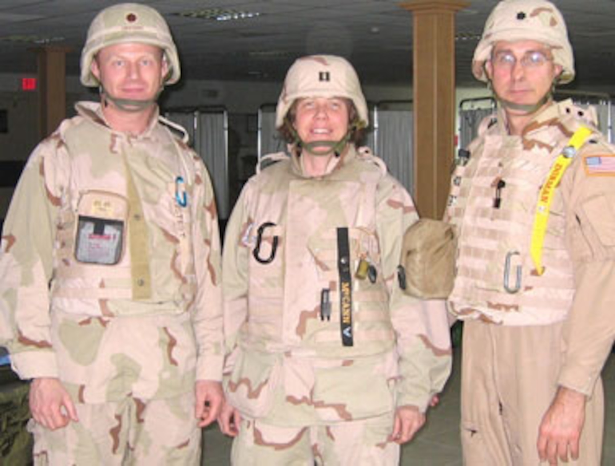 From left, Maj. Robert Rostedt, Maj. Maureen McCann (then still a captain) and Lt. Col. Robert Dorman cared for patients in Balad, Iraq. The three are Air Force reservists assigned to the 439th Aeromedical Staging Squadron at Westover Air Reserve Base, Mass. (Courtesy photo)